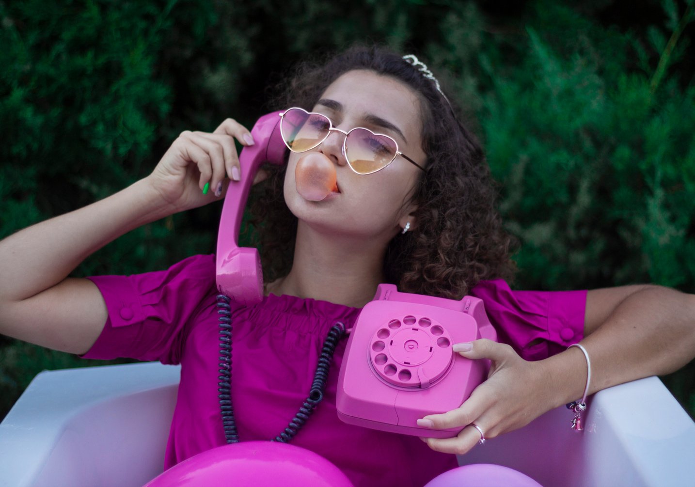 Woman Holding a Pink Phone